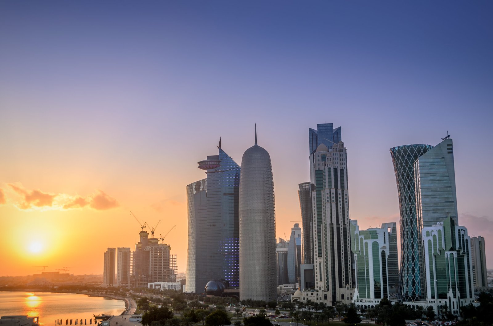 Sunset over the skyscrapers of doha city  scaled
